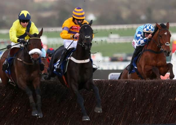 Gold Present, centre, seen in action at Cheltenham last year (Picture: David Davies/PA Wire).
