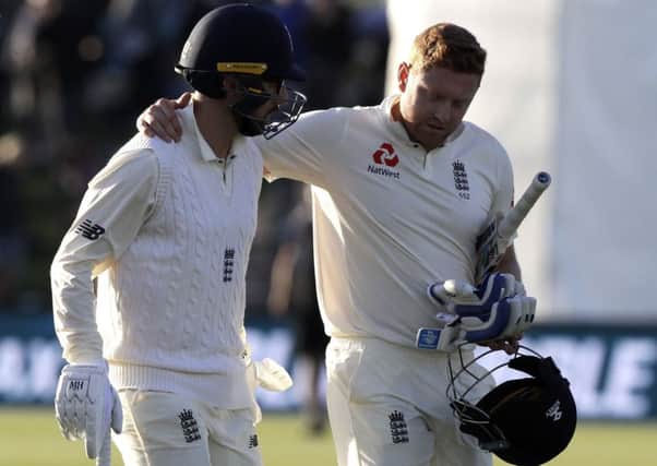 Hero: England's Jonny Bairstow, right, embraces teammate Jack Leach as they leave the field at the close of play on day one of the second Hest against New Zealand.