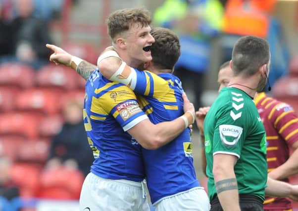 Leeds Rhinos' Ash Handley celebrates his late try against Huddersfield Giants.  Picture Tony Johnson.