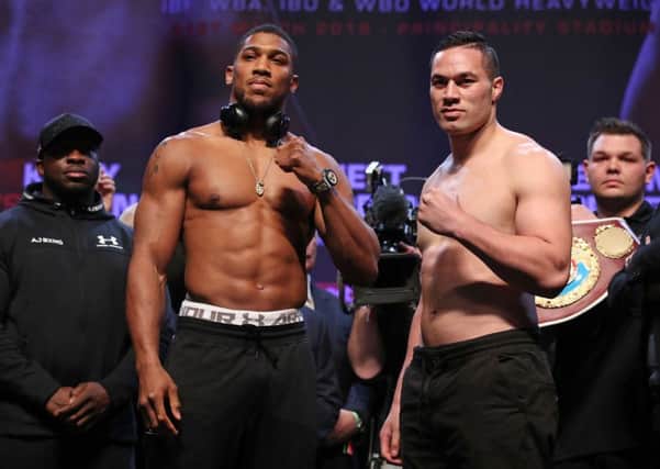 Anthony Joshua and Joseph Parker during the weigh in at the Motorpoint Arena, Cardiff. (Picture: Nick Potts/PA Wire)