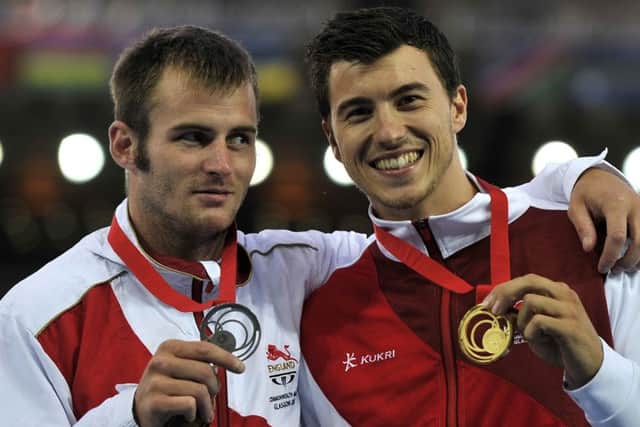 England's Luke Cutts (left) with his silver medal next to team mate Steve Lewis with his gold medal for the Men's Pole Vault during the 2014 Commonwealth Games in Glasgow. (Picture: John Giles/PA Wire)