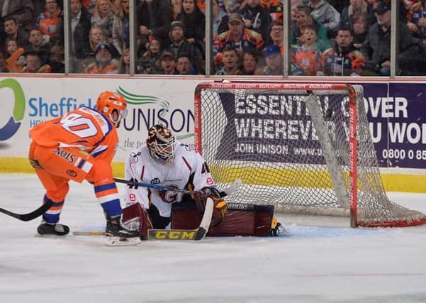 WONDER GOAL: John Armstrong strikes the puck past Guildford's Brian Stewart on Saturday, completing a brilliant solo effort that started from behind his own goal. Picture: Dean Woolley.