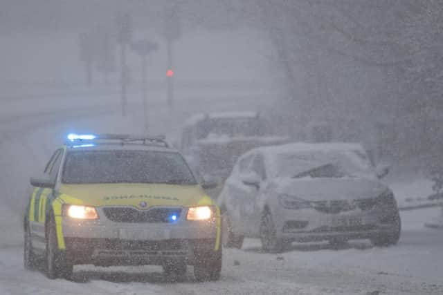 An ambulance driver works their way through the snow at Ainley Top Huddersfield. Picture: Charlotte Graham