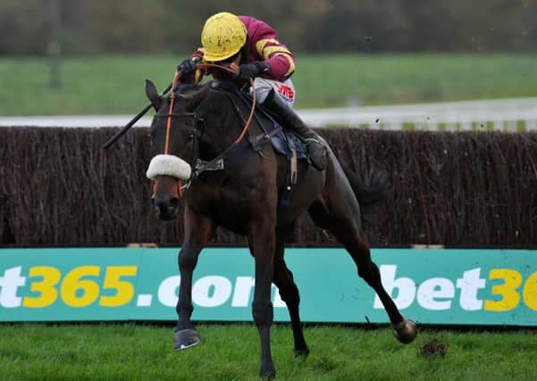 Harry Topper and Jason Maguire clear the last in the 2013 Charlie Hall Chase at Wetherby.