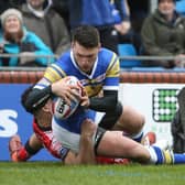 Tom Briscoe goes over for Rhinos' first try.