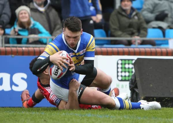 Tom Briscoe goes over for Rhinos' first try.