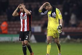 SO CLOSE: Sheffield United's George Baldock, left, and Simon Moore show their frustration over Monday night's draw at Bramall Lane. Picture: Simon Bellis/Sportimage