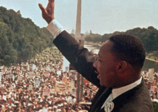 Martin Luther King acknowledges the crowd gathered for his I Have a Dream speech in 1963. (Picture: AP).