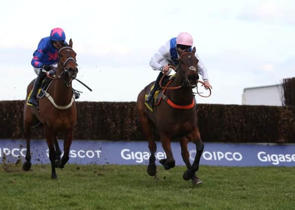 Waiting Patiently and jockey Brian Hughes, right, clear the last and get the better of the legendary Cue Card in the Ascot Chase.