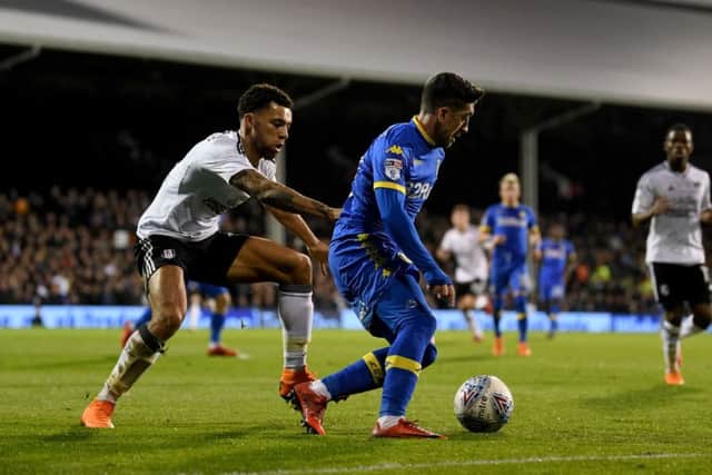 Leeds United's Pablo Hernandez battles with Fulham's Ryan Fredericks at Craven Cottage on Tuesday night. Picture: James Hardisty.