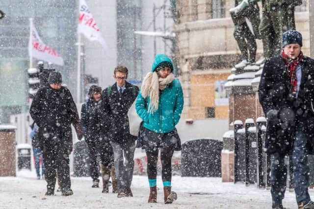 Date: 1st March 2018. Picture James Hardisty. Persistent snow fall over night in Yorkshire, from the polar vortex nicknamed  'Beast from the East' which has hits Britain with snow and freezing temperatures and could last most of the week causing horrific conditions for commuters. Pictured Members of the public braving the conditions in Leeds City Centre.