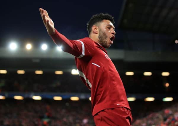 Liverpool's Alex Oxlade-Chamberlain celebrates scoring his side's second goal of the game during the UEFA Champions League quarter final, first leg match at Anfield