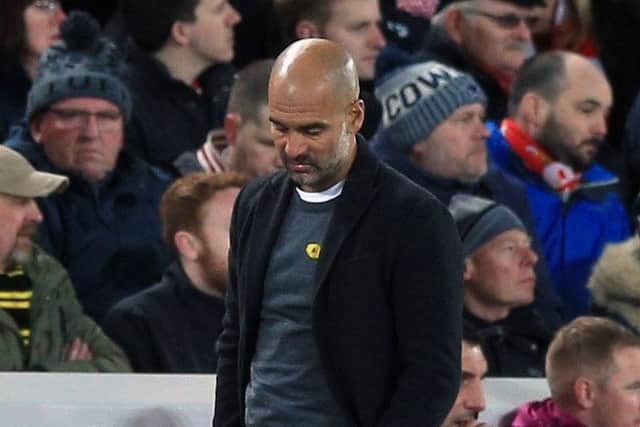 Manchester City manager Pep Guardiola appears dejected during the UEFA Champions League quarter final (Pictures: Peter Byrne/PA Wire)