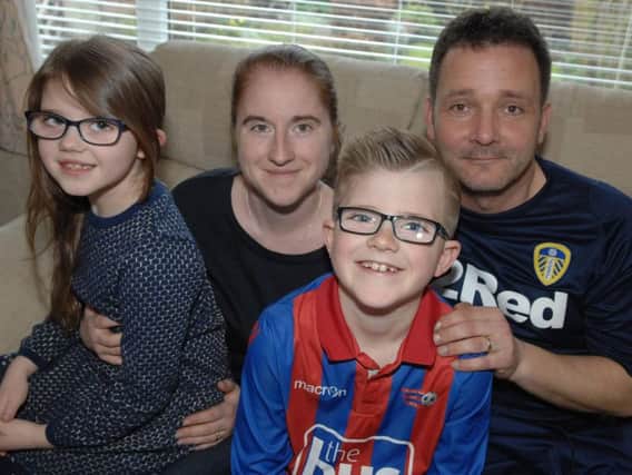 Eight-year-old Harrison Morrell with his dad Darren, mum Amy, and younger sister Tilly (7). (1804034AM1)