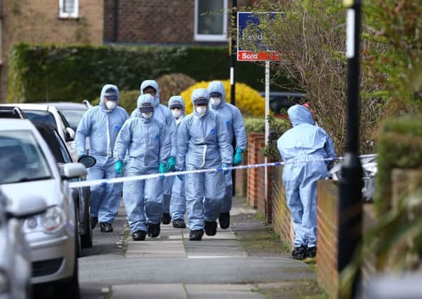 Forensic officers at the scene in South Park Crescent in Hither Green, London. PIC: PA