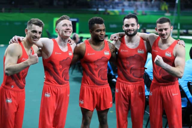 England's (left-right) Max Whitlock, Nile Wilson, Courtney Tulloch, James Hall and Dominick Cunningham won Englands first gold medal of the Commonwealth Games in the mens gymnastics team event at the Coomera Indoor Sports Centre. Picture: Mike Egerton/PA.