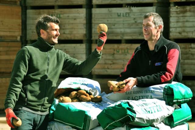 Rob (left) and Dave Lee of Corner Farm near Brandesburton with some of their potatoes.