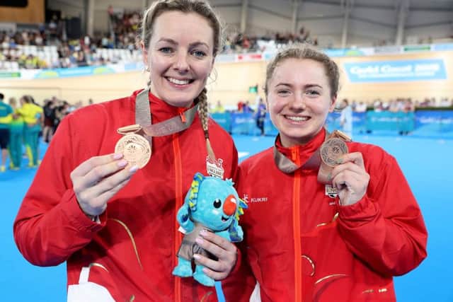 England's Katy Marchant (left) and Lauren Bate with their bronze medals after the Women's Team Sprint Finals Bronze Medal Race at the Commonwealth Games. Picture: Martin Rickett/PA