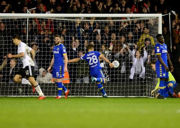 Frustration: Gaetano Berard fires the ball into the back of his goal after Leeds go 2-0 down at Fulham.