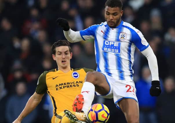 On target: Huddersfield Town's Steve Mounie scored the second against Brighton.