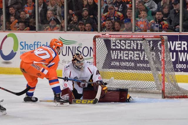 MARVEL: John Armstrong finishes off an end-to-end solo charge by flicking the puck past Guildford Flames' netminder Brian Stewart at Sheffield Arena in the play-off quarter-final. Picture: Dean Woolley.