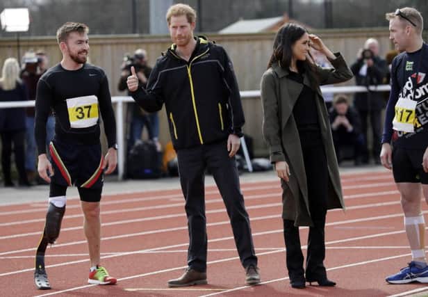 Prince Harry (second left) and Meghan Markle meet athletes at the University of Bath Sports Training Village, Bath for the UK team trials for the Invictus Games Sydney 2018.