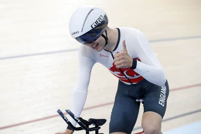 England's Charlie Tanfield celebrates setting a new games record in the Men's 4000m Individual Pursuit Qualifying at the Anna Meares Velodrome