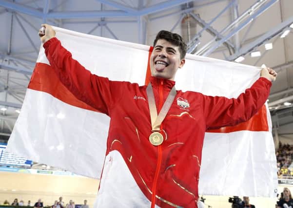 England's Charlie Tanfield celebrates with his gold medal in the Men's 4000m Individual Pursuit Finals. (Picture: PA)
