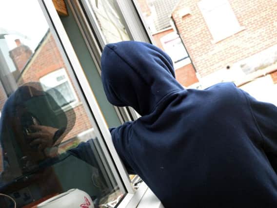 A burglar tries to gain access to a home