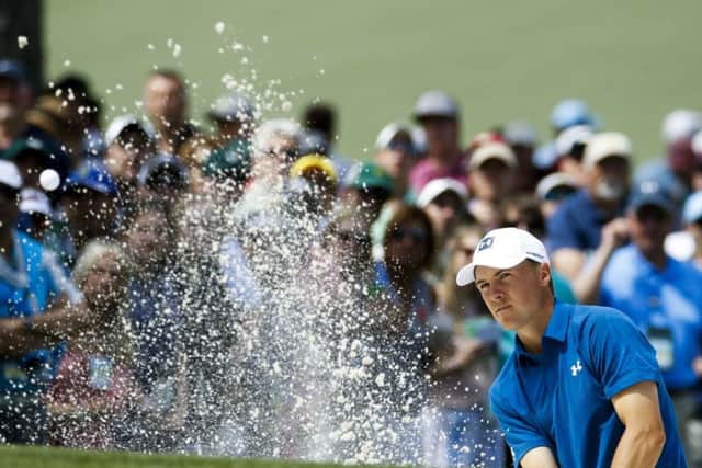 Jordan Spieth hits from a bunker on the seventh hole during the second round at The Masters. (AP/Charlie Riedel