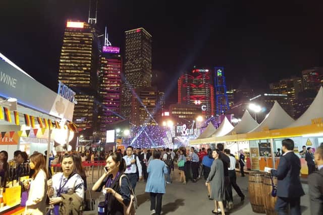Locals and visitors explore wines of the world at the evening Wine & Dine Festival by Victoria Harbour. PA Photo/Francesca Gosling.