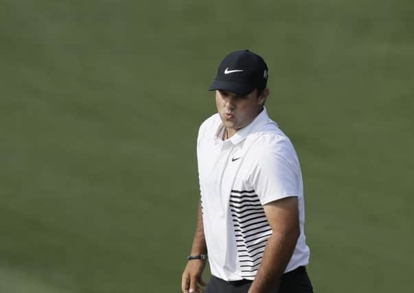 Patrick Reed reacts after missing a par putt on the 10th hole during the second round at the Masters. Picture: AP/David J. Phillip