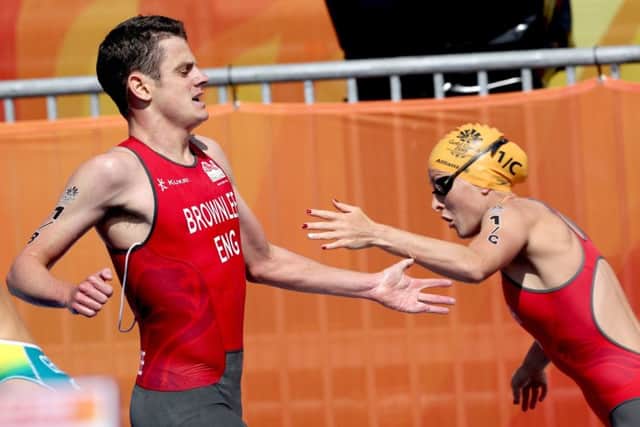 England's Jonathan Brownlee hands over to team-mate Jessica Learmonth during the Mixed Team Relay Triathlon final. Picture: Danny Lawson/PA