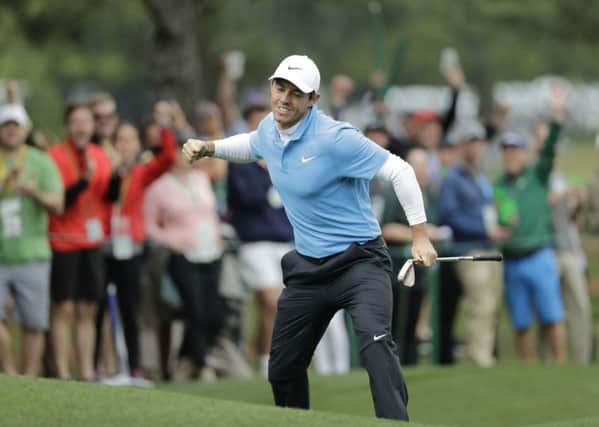 Get in: Rory McIlroy reacts after his eagle on the eighth hole during the third round. Picture: AP Photo/David J Phillip