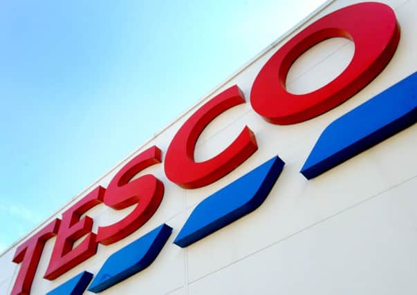 File photo dated 26/08/16 of a Tesco sign. Tesco will report to the market next week for the first time since completing its Â£3.7 billion takeover of wholesaler Booker, with analysts expecting a healthy rise in full year profits. PRESS ASSOCIATION Photo. Issue date: Sunday April 8, 2018. The supermarket giant is forecast to post a 22% rise in operating profit to Â£1.56 billion for the year to February, according to a consensus of City analysts. See PA story CITY Forecast. Photo credit should read: Nick Ansell/PA Wire