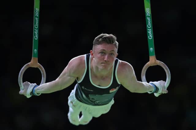 England's Nile Wilson on the Rings on his way to winning a gold medal in the Men's Individual All-Round Final