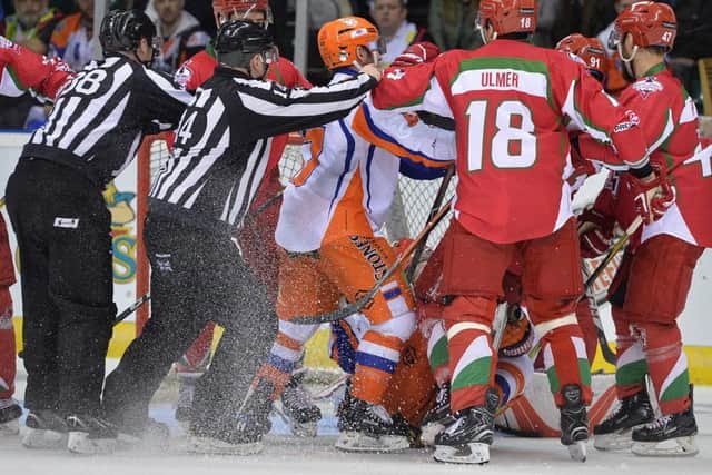 GETTING TO KNOW YOU: Sheffield Steelers and Cardiff Devils' players exchange pleasantries during Sunday's final. Picture: Dean Woolley.