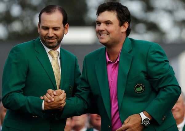 Winner: Former Masters champion Sergio Garcia, left, shakes hands with Patrick Reed after his victory at the Masters.