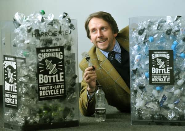 300118  James Cain Managing Director of  Harrogate Spring Water alongside their shrinking bottles  making it easier to recycle.
