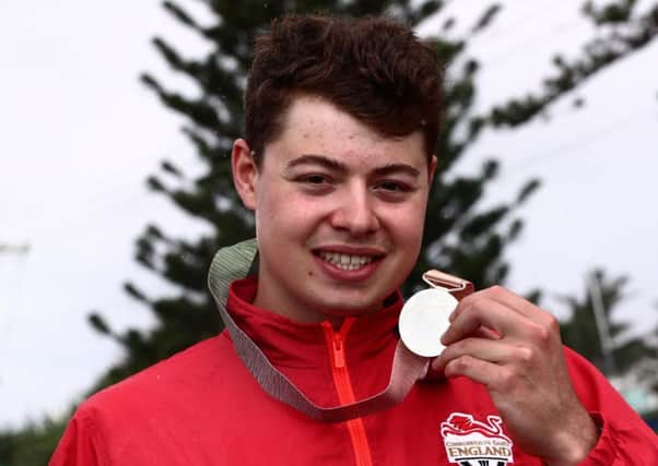 Silver lining: Harry Tanfield poses with his silver medal.