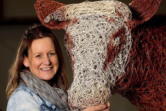 Artist Emma Stothard pictured with her finished sculpture of the Craven Heifer, commissioned by the Yorkshire Agricultural Society.