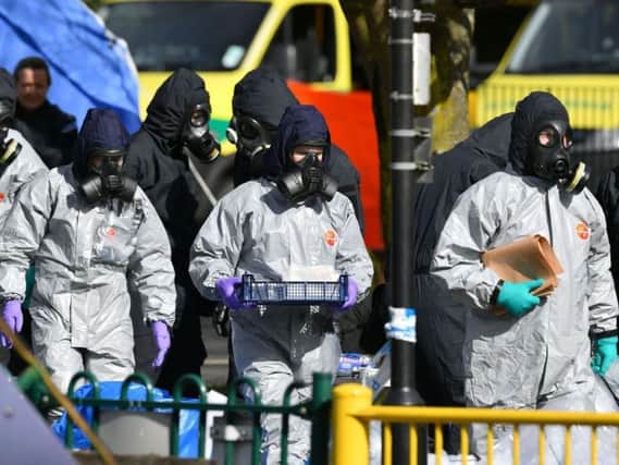 Police in protective suits at the shopping centre in Salisbury where former Russian double agent Sergei Skripal and his daughter Yulia were found critically ill,