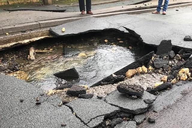 The burst created a large hole in the road.