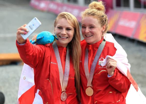 Champion: England's Evie Richards, silver, and Annie Last, gold, take a selfie with their medals.
