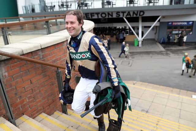 Amputee jockey Captain Guy Disney after completing the Grand National course.