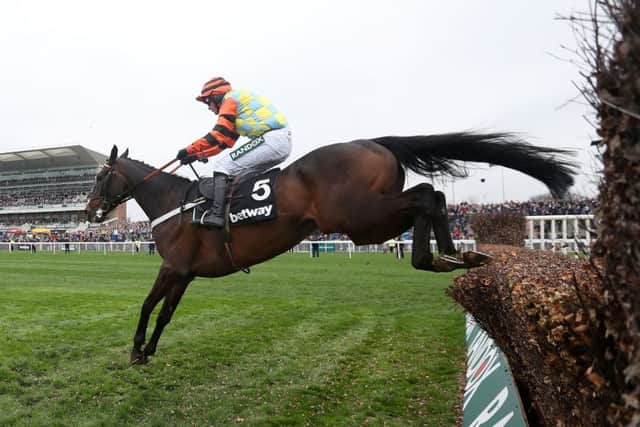 Might Bite, ridden by Nico de Boinville, jumps the last on its way to winning the Betway Bowl Chase at Aintree (Picture: David Davies/PA Wire).