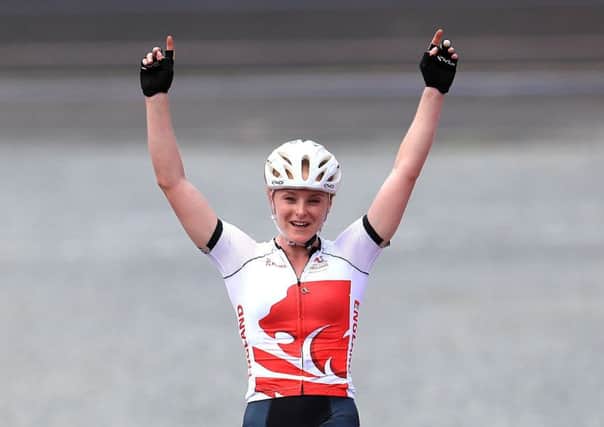 England's Annie Last celebrates winning gold in the Women's Cross-Country at the Nerang Mountain Bike Trails. Picture: Mike Egerton/PA.