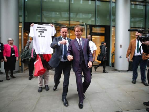 Sir Cliff Richards leaves the High Court yesterday