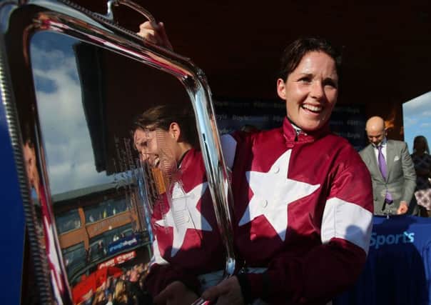 Katie Walsh is among three female riders hoping to make Grand National history today.