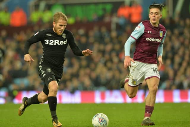 Samuel Saiz is chased by Jack Grealish at Villa Park.
 Picture: Bruce Rollinson